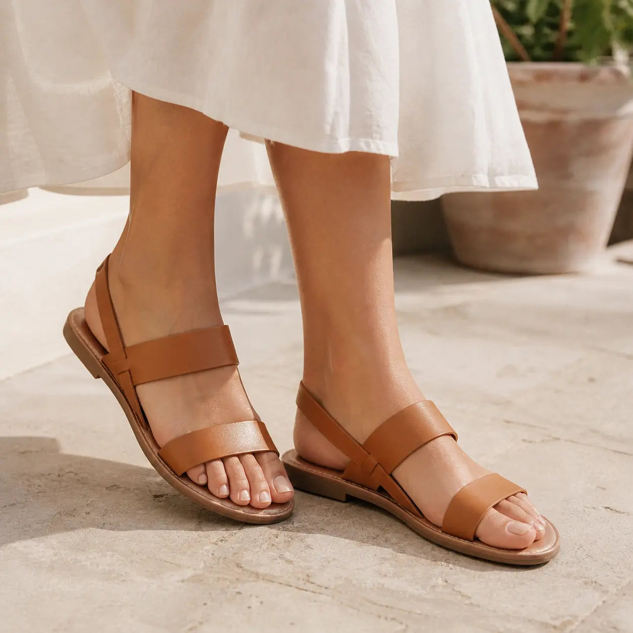 Front view of women's flat sandals with slim straps