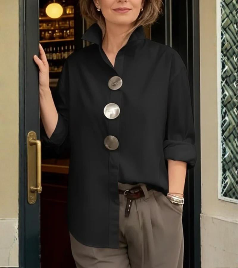 Women's blouse shown from the back with a clean, polished silhouette