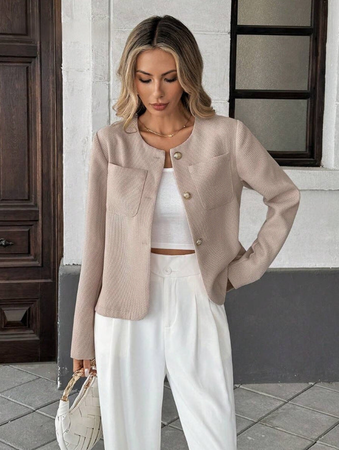 Back view of the women's short tweed jacket with its neat, tailored shape