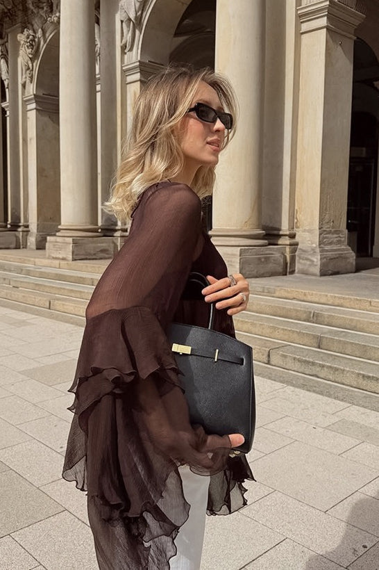 Elegant blouse featuring layered ruffle cape sleeves