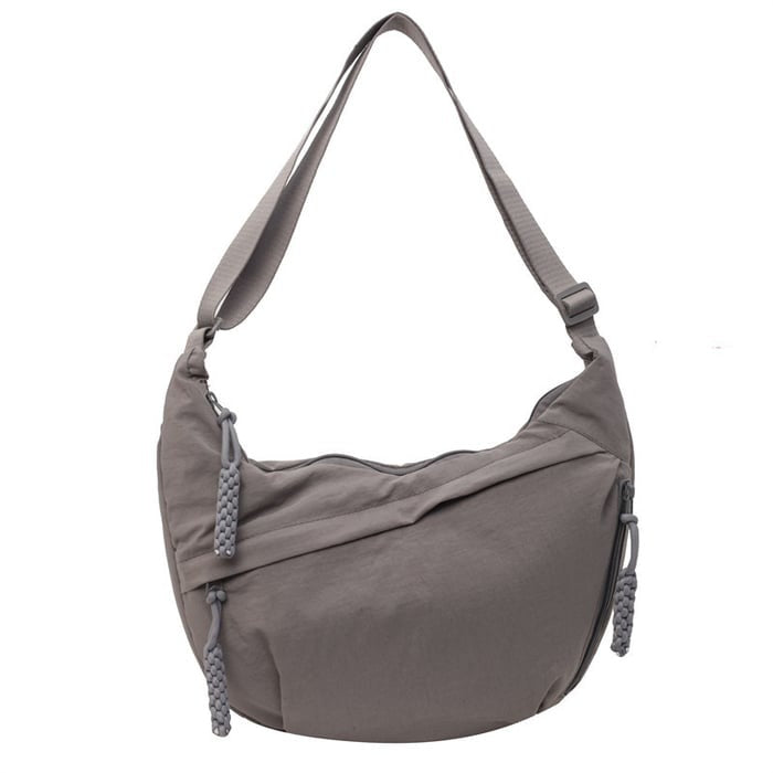 Women's everyday nylon crossbody bag displayed with zip pockets visible