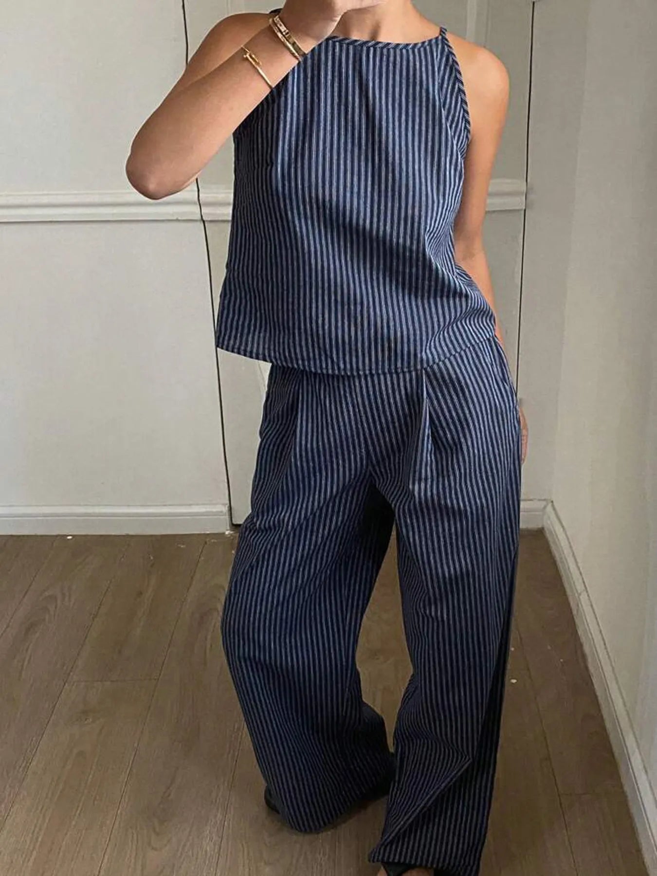 Wide-leg pants paired with a matching striped tank top