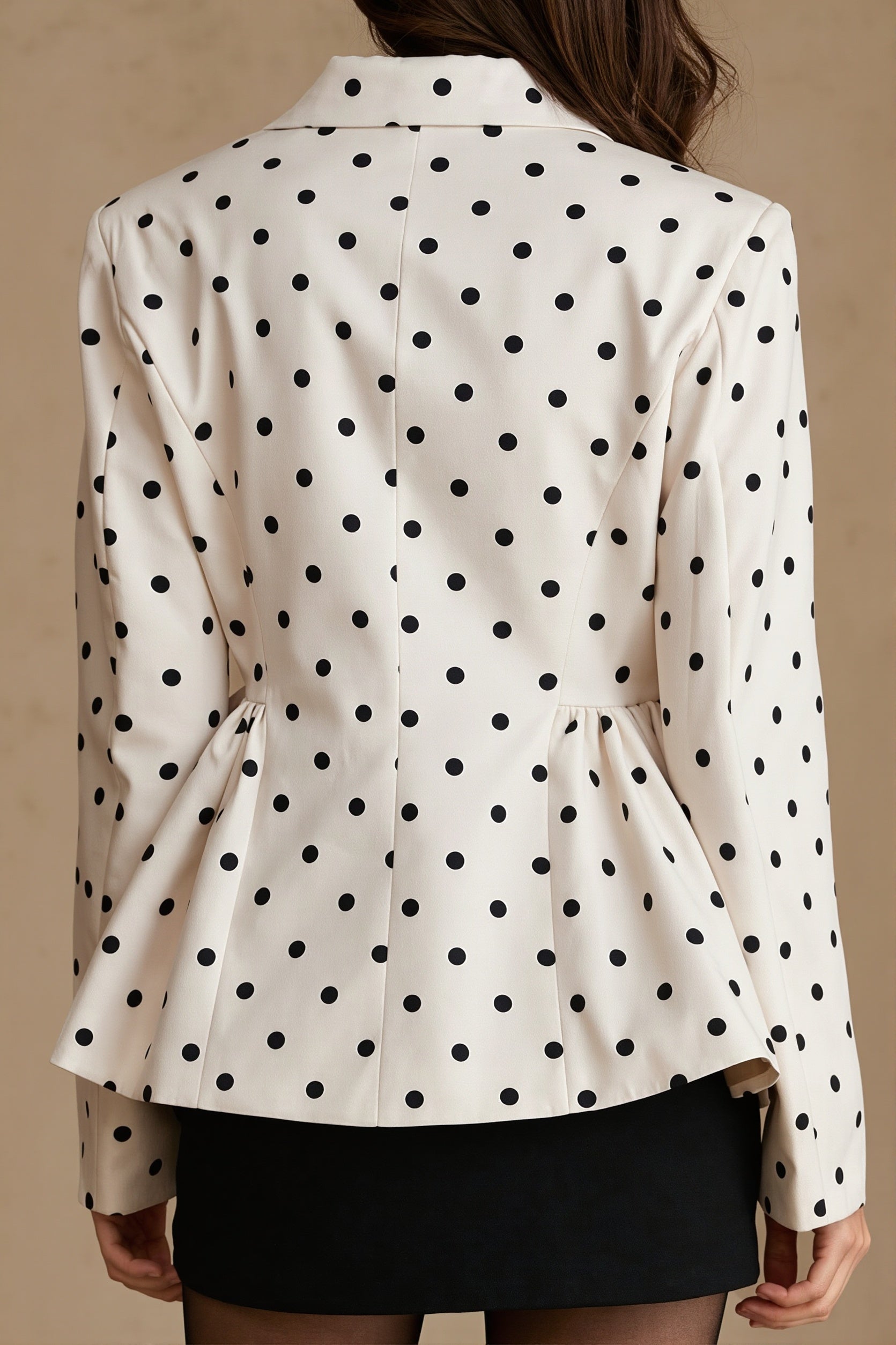 Women's polka dot blazer styled as a polished workwear layer