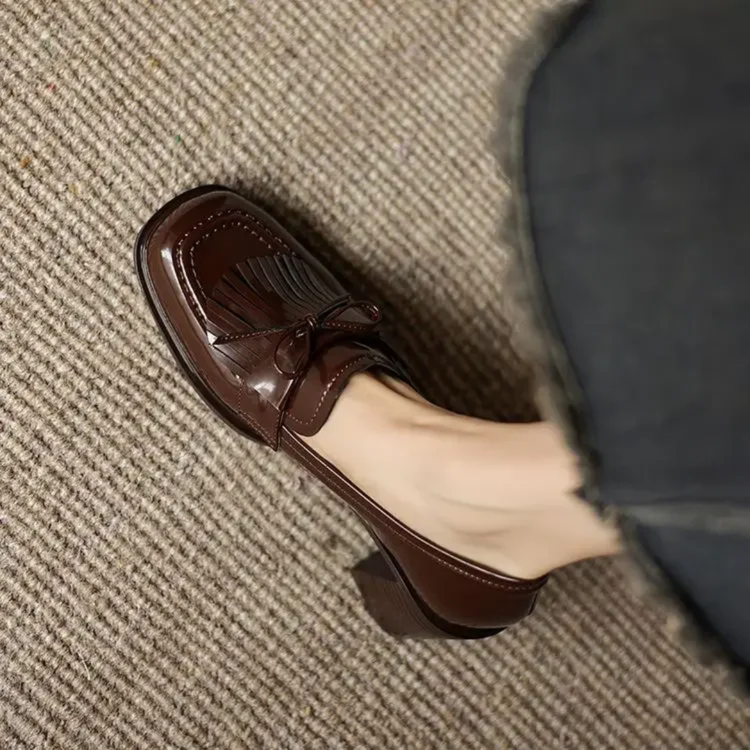 Top view of women's heeled loafers highlighting the classic silhouette