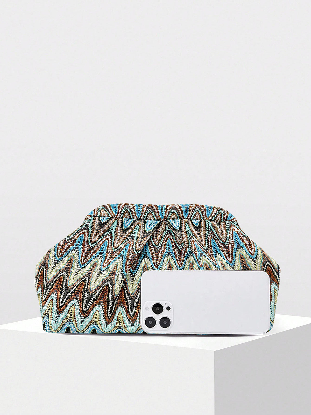 Compact evening clutch with ruched design and zigzag pattern side view