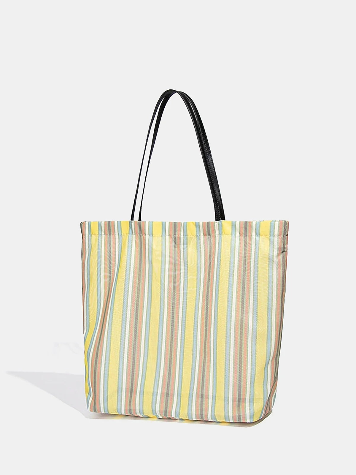 Large rainbow stripe shoulder bag angled view showing shape and shoulder straps