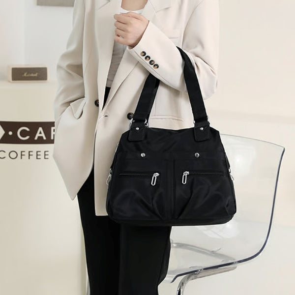 Close-up of durable nylon fabric and pocket details on laptop tote bag