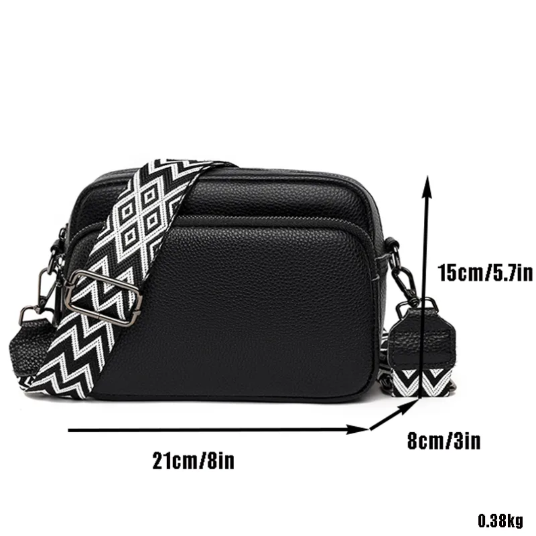 Modern leather messenger bag for women shown at a slight angle