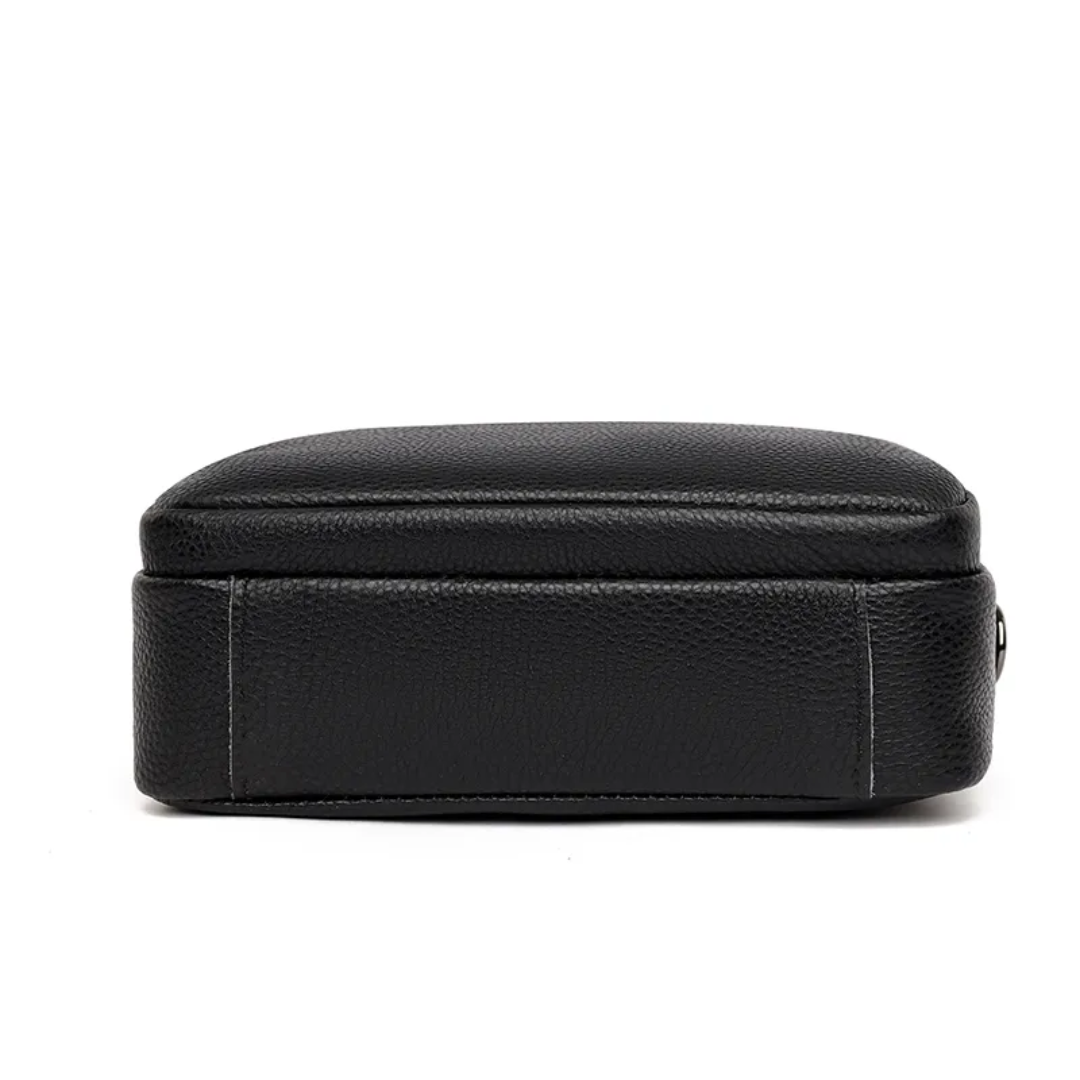 Women's leather messenger bag with strap detail and clean structured shape