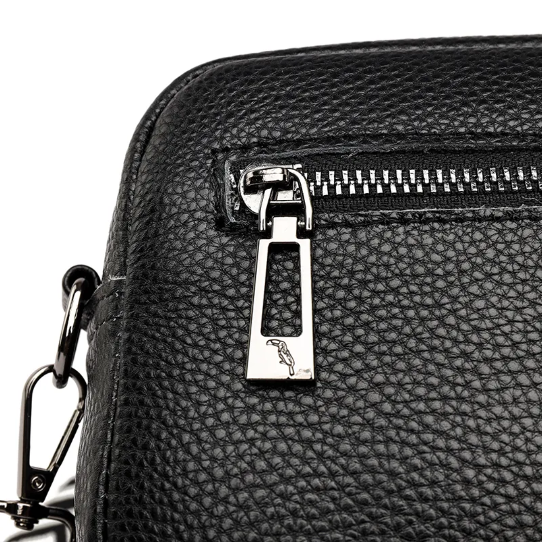 Interior view of women's leather messenger bag showing main compartment