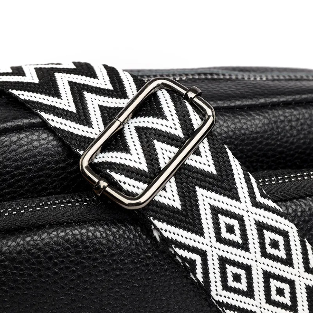 Women's leather messenger bag styled as a shoulder bag with adjustable strap