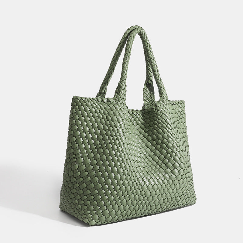 Braided women's tote bag highlighting the woven texture and shape