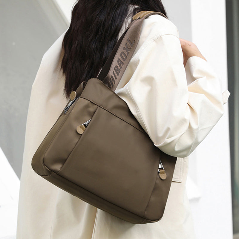 Open crossbody bag showing multiple compartments for organized daily essentials