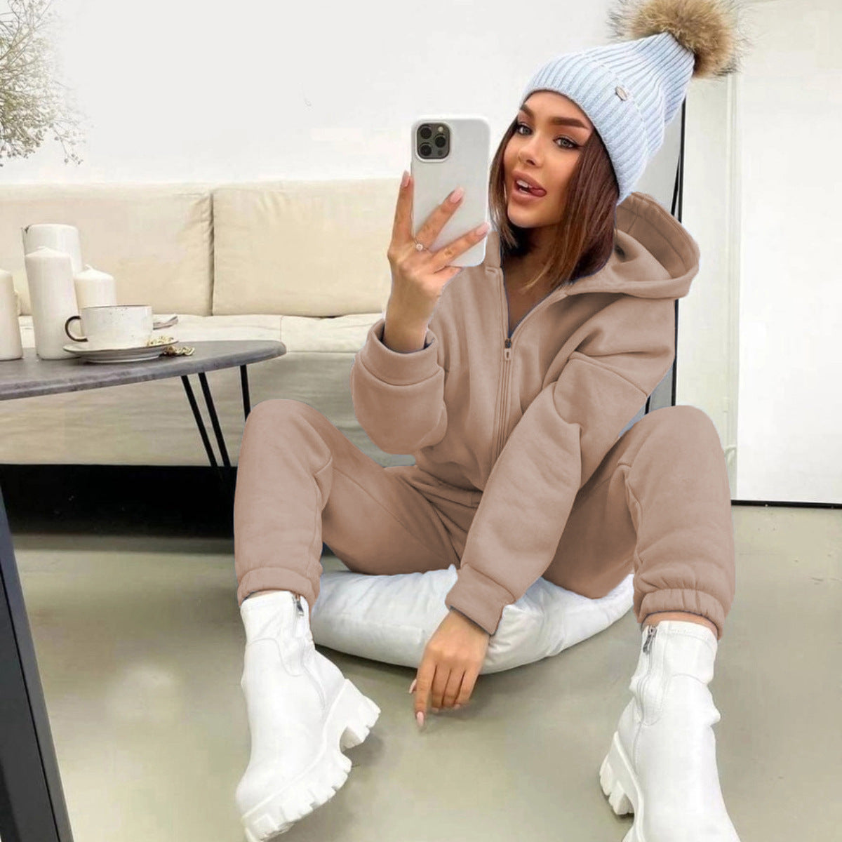 Women's fleece-lined hoodie and jogger set styled as a coordinated casual outfit