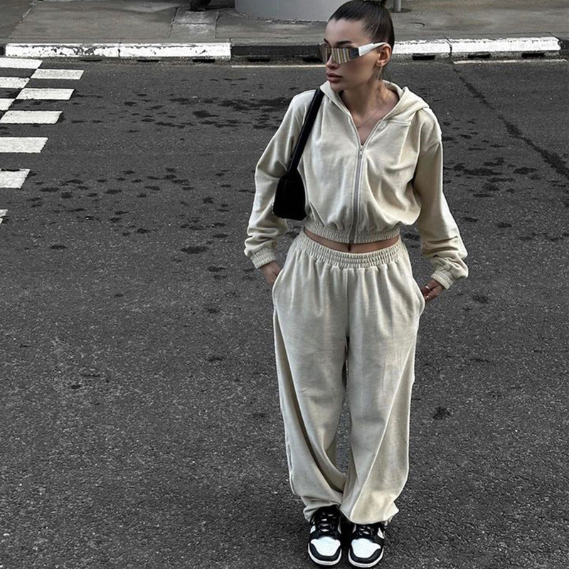 Two-piece women's velvet tracksuit styled as a casual everyday outfit