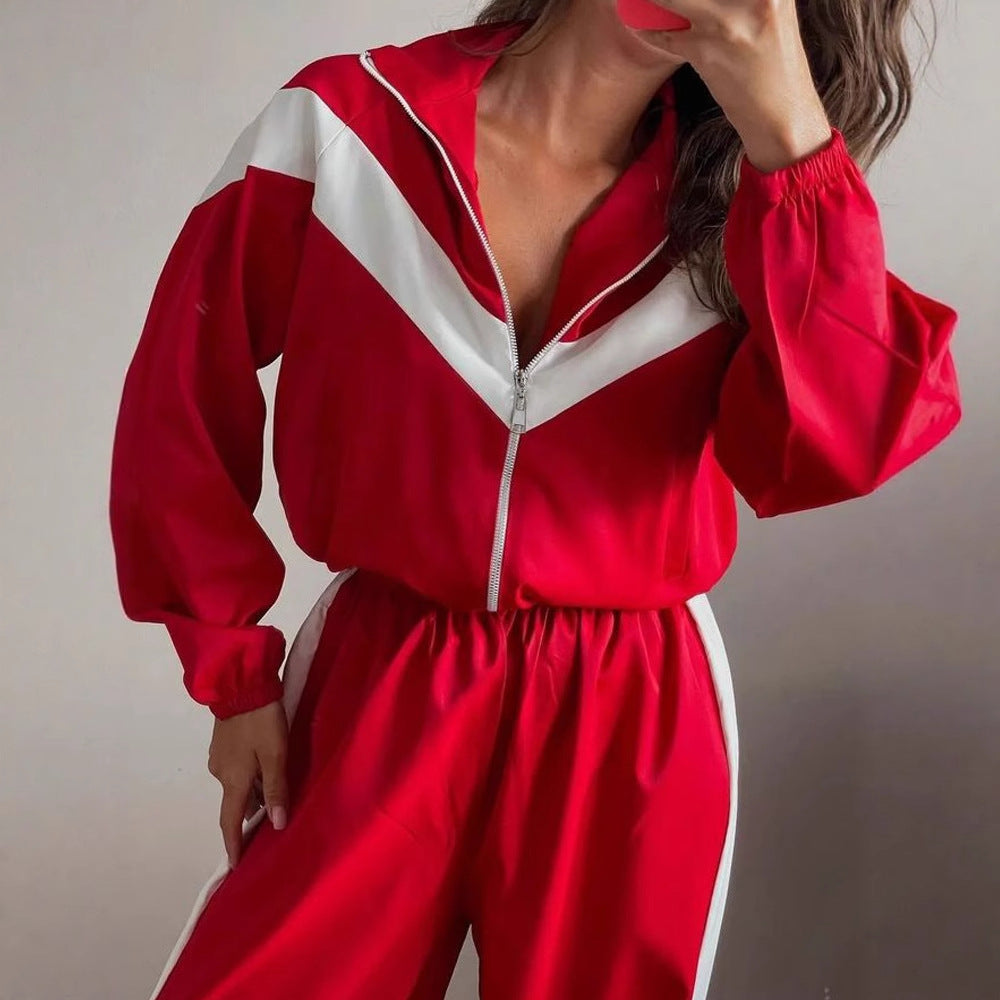 Women's satin track suit shown from the back with a coordinated chevron stripe