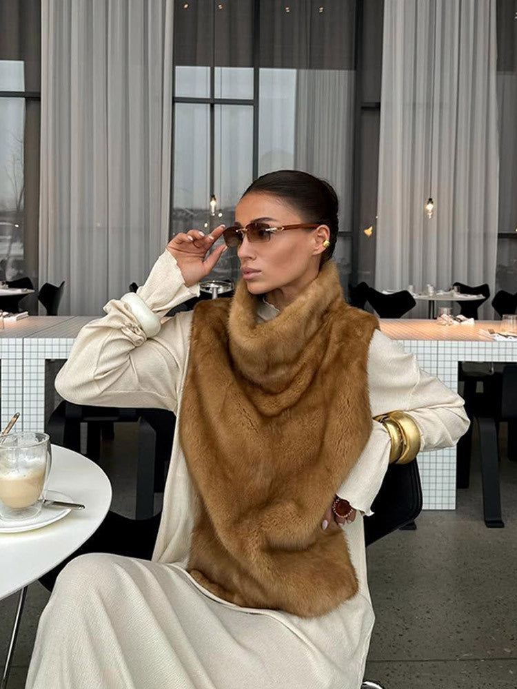 Women's faux fur wrap scarf shown as an elegant outfit accessory