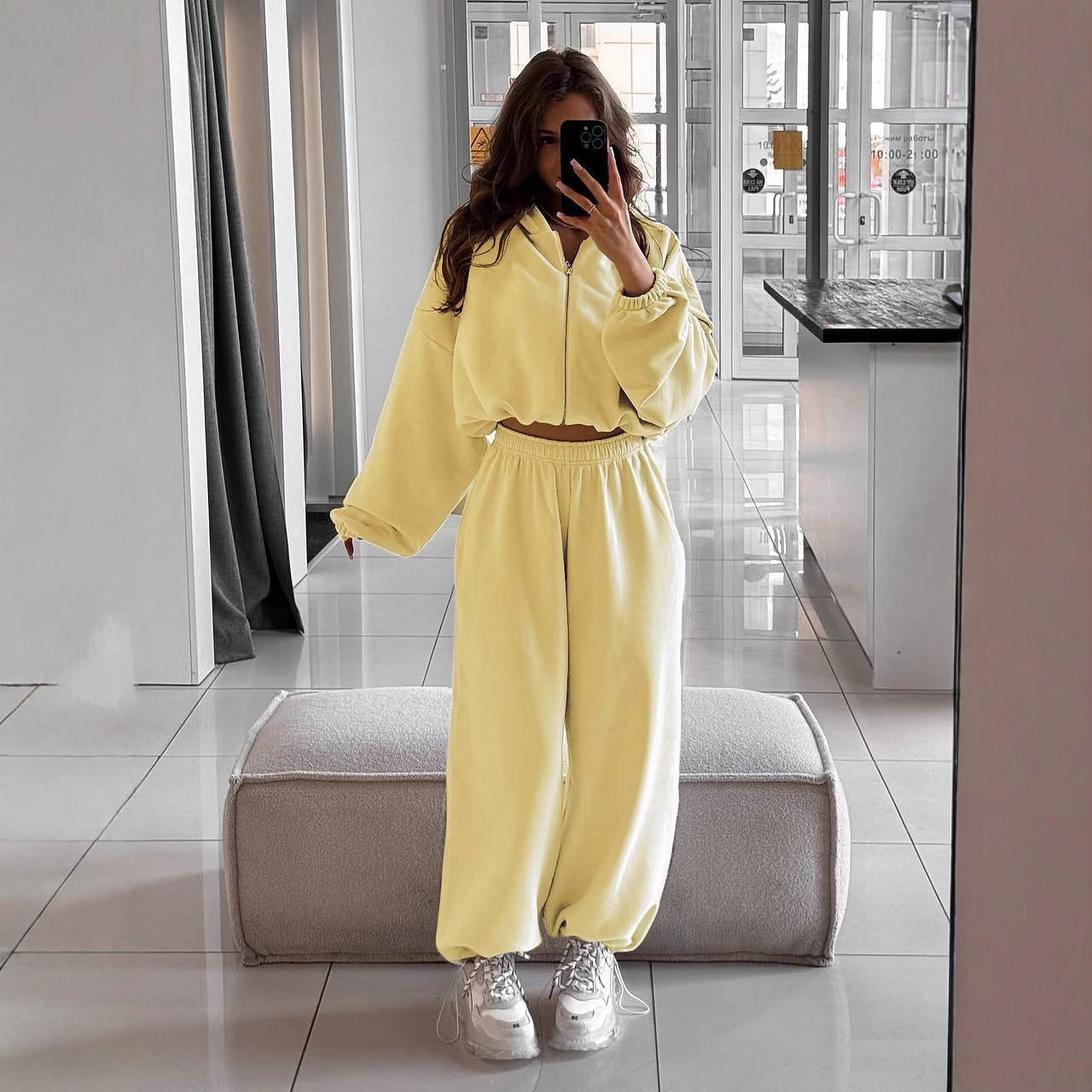 Women's oversized hoodie and high-waist jogger set shown from the front
