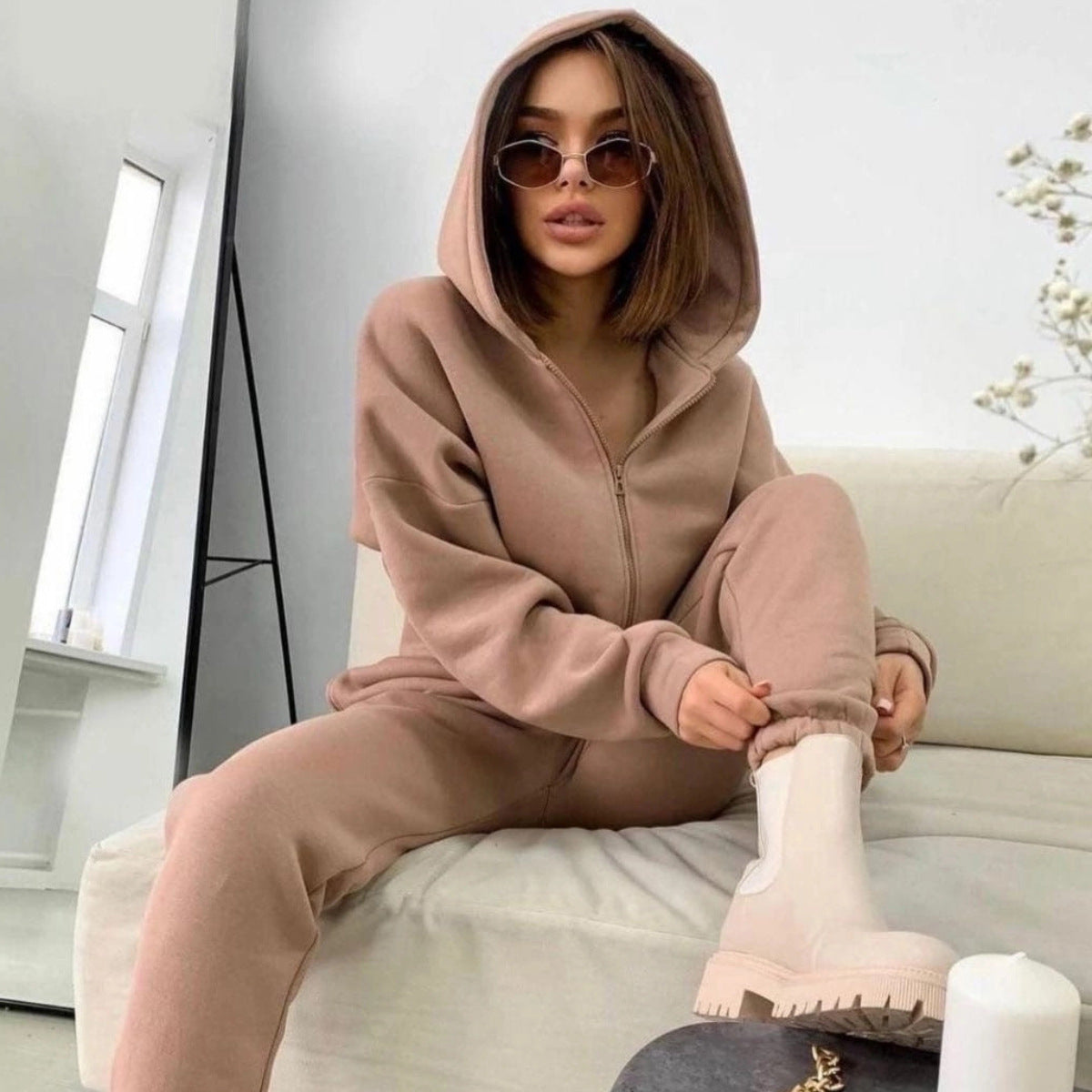 Women's hoodie featuring a drawstring hood and full front zipper