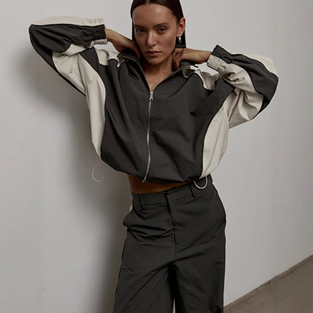 Side view of a women's oversized track jacket with raglan sleeves