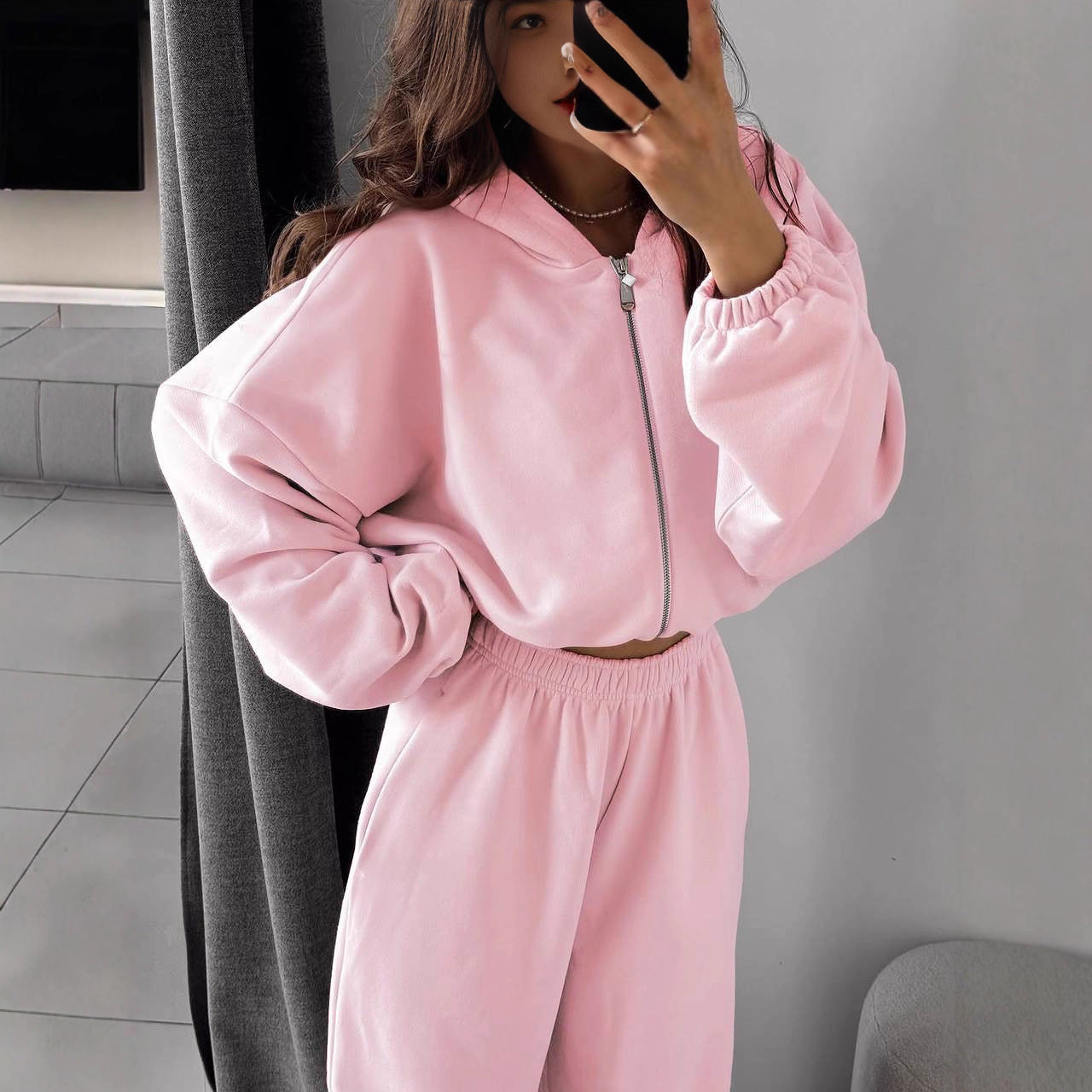 Back view of the oversized hoodie and high-waist jogger outfit