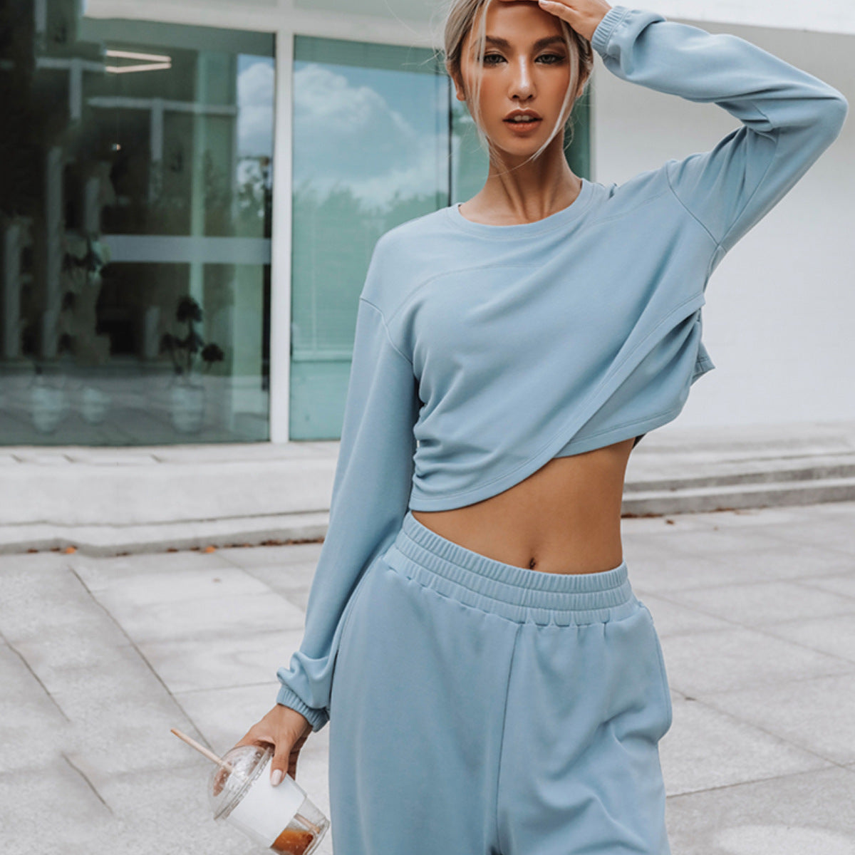 Coordinated women's lounge outfit with wide-leg pants and cropped sweatshirt