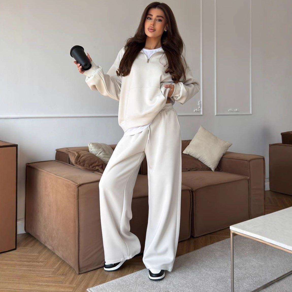 Women's half-zip lounge set with hoodie and wide-leg pants, front view