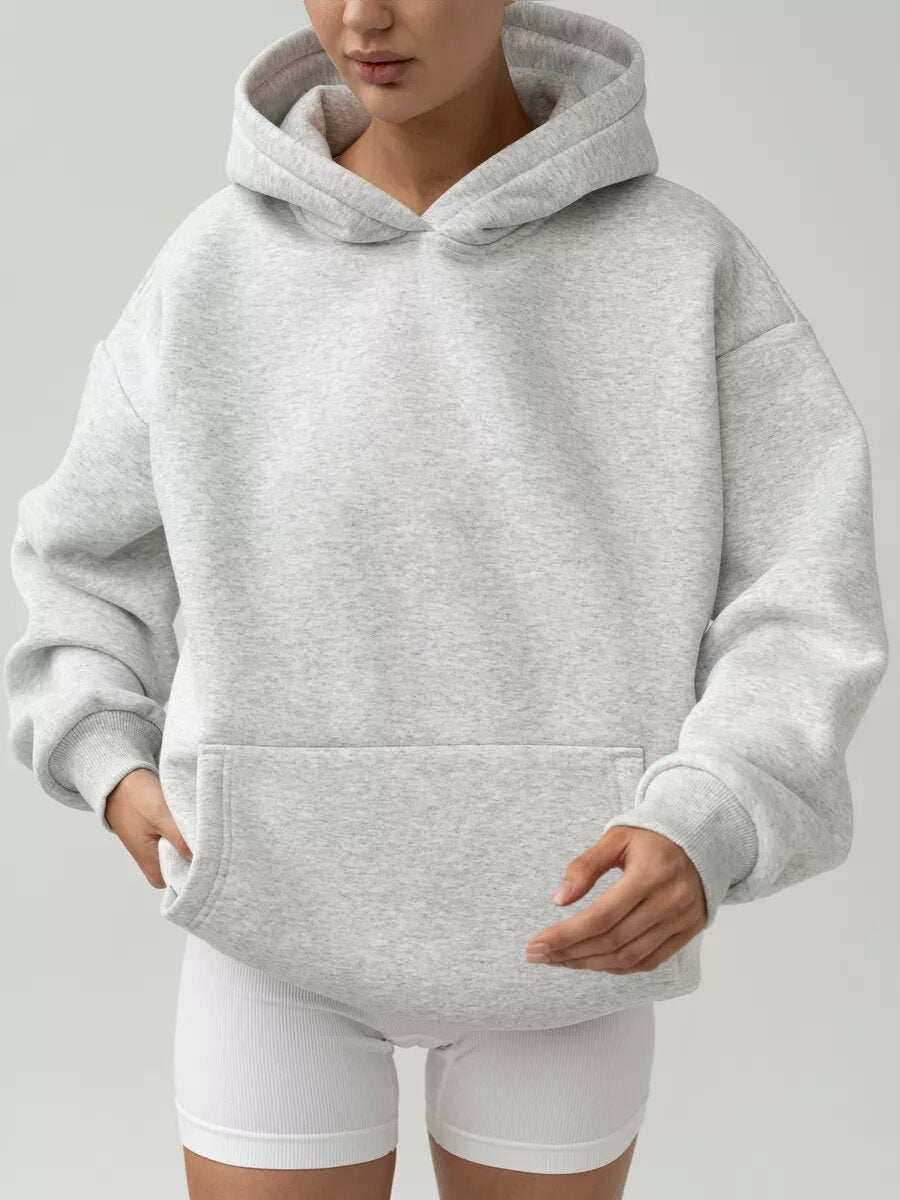 Women's hoodie displayed with its hood, long sleeves, and front kangaroo pocket