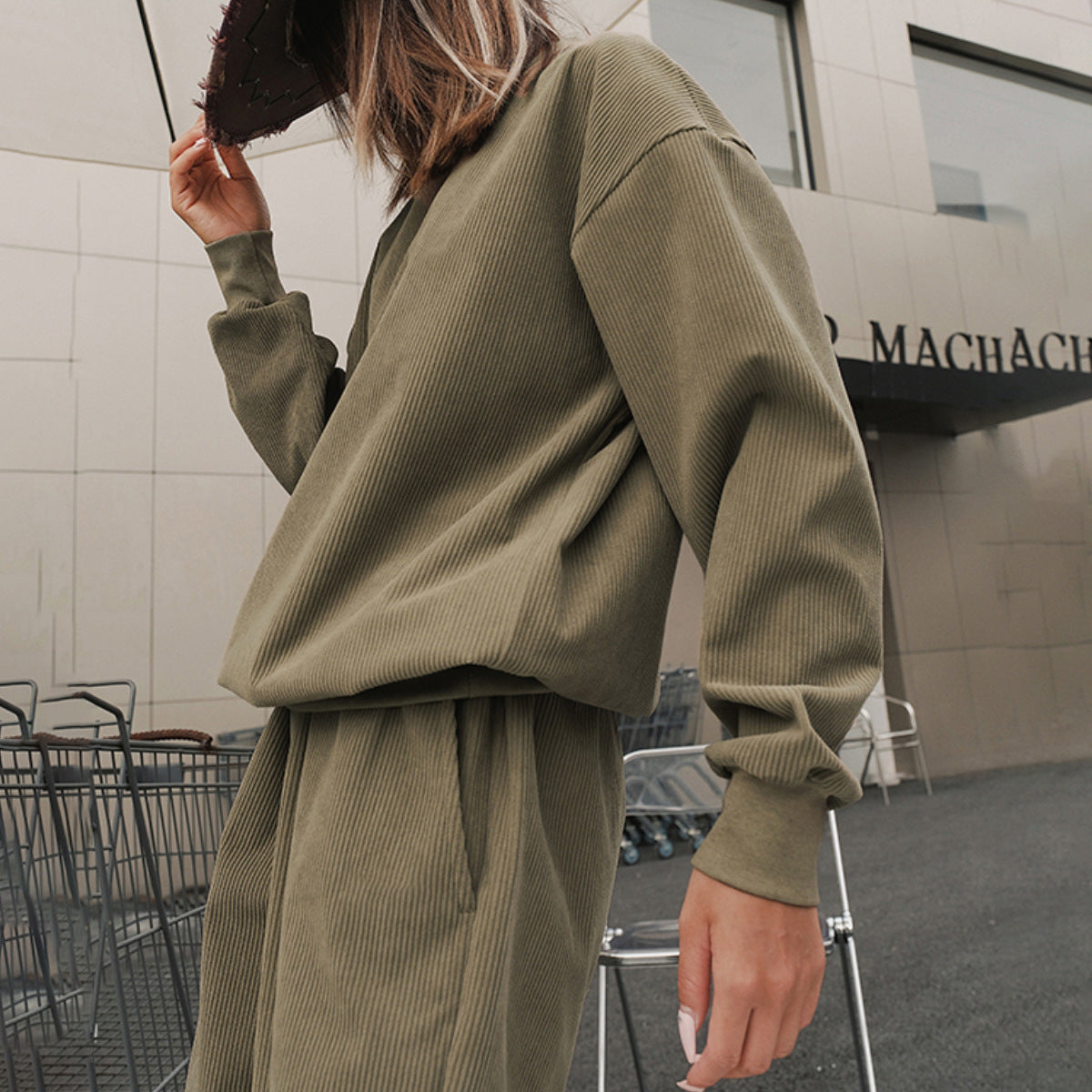 Front view of a women's corduroy tracksuit set with cuffed jogger pants