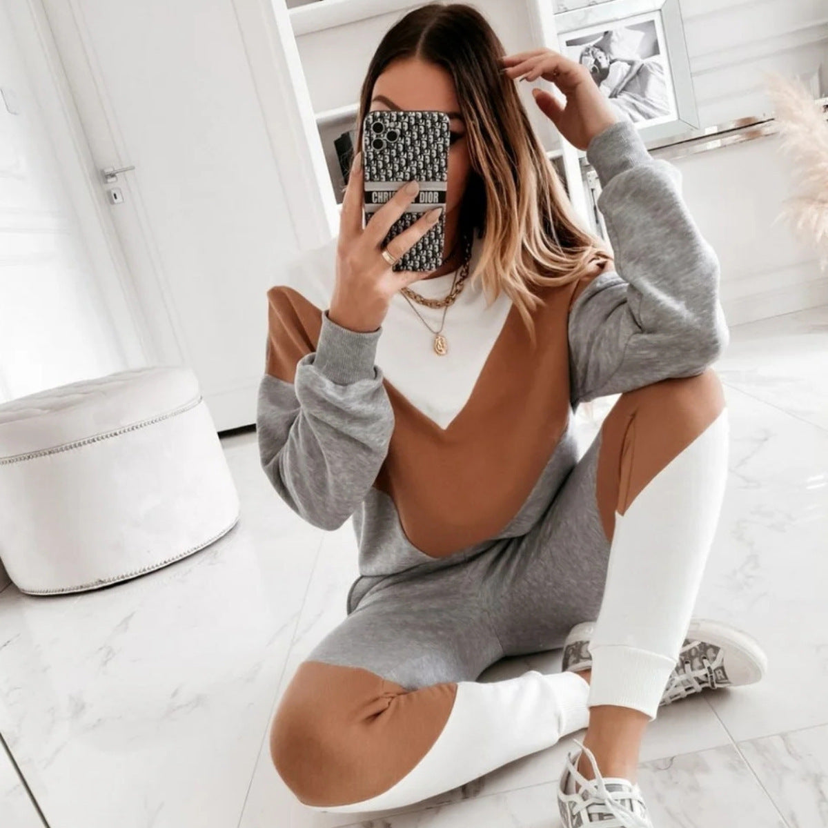 Women's sweatshirt set paired with tailored jogger pants