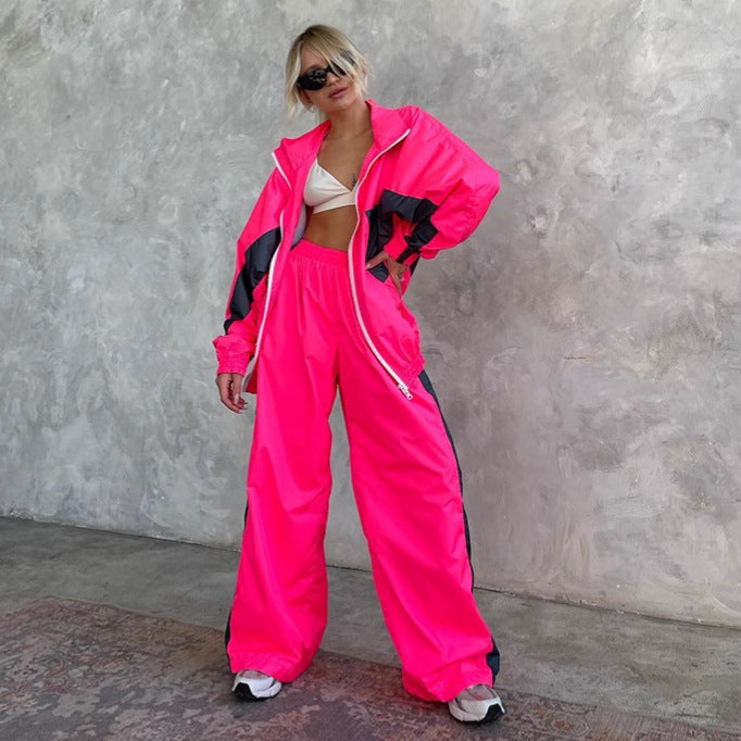 Women's athleisure outfit featuring a windbreaker and loose-fit pants