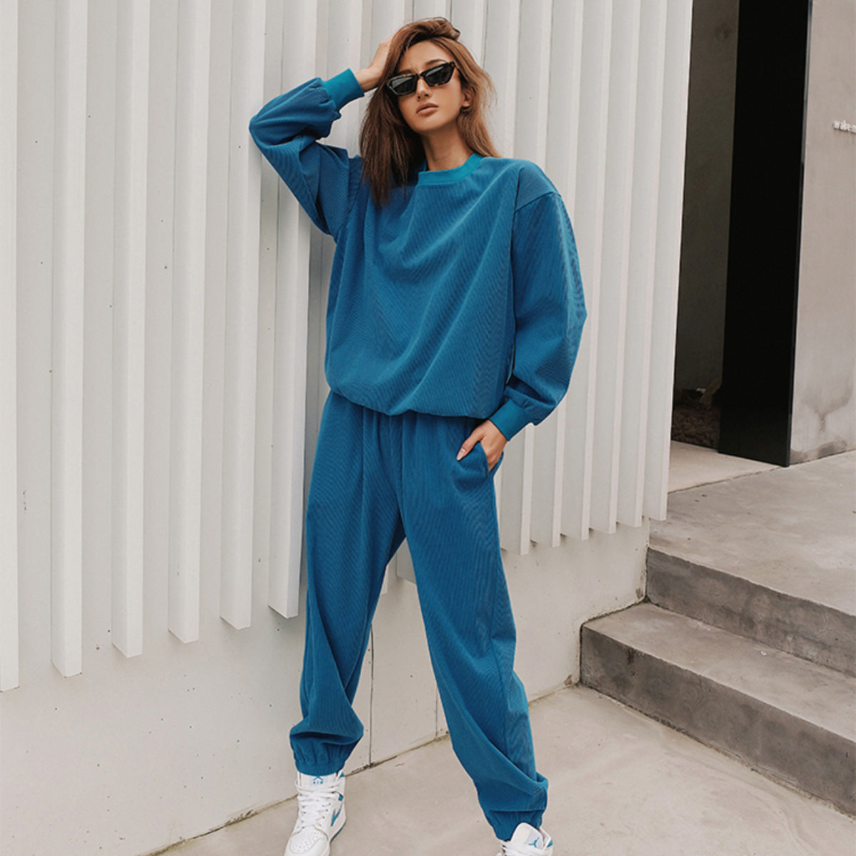 Close-up of the textured corduroy fabric on a women's tracksuit set