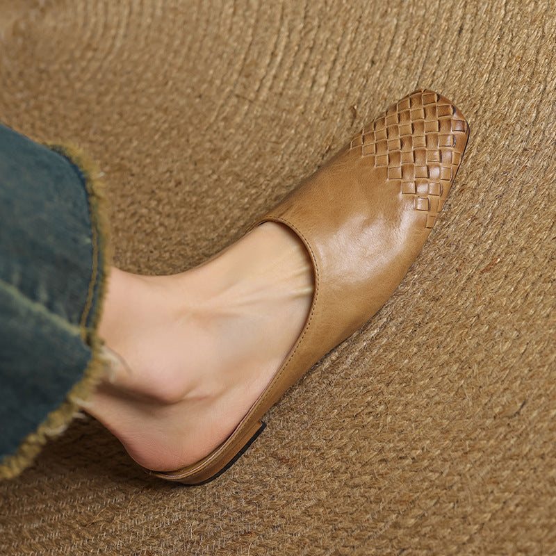 Pair of leather mules showing the woven toe detail