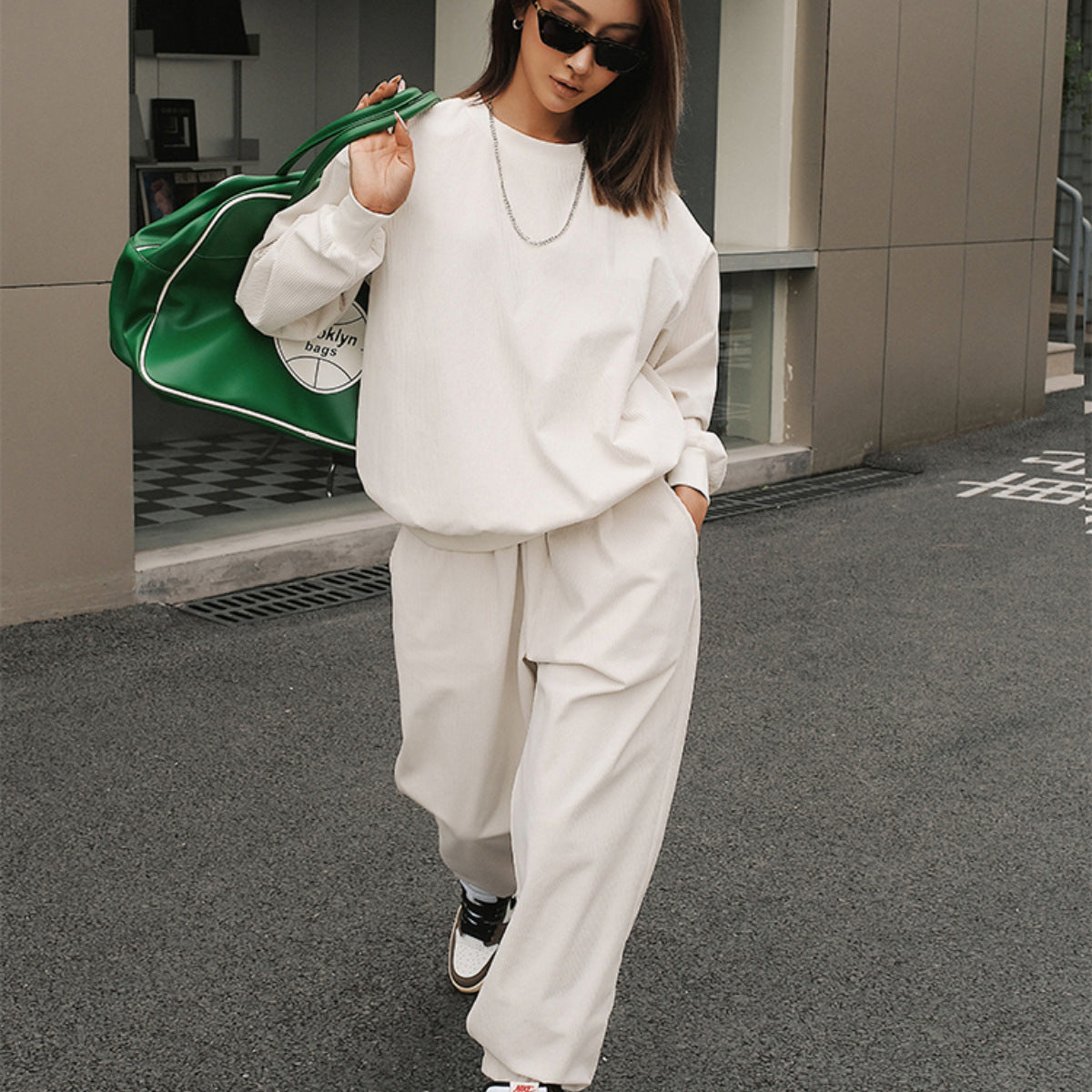 Women's relaxed-fit corduroy tracksuit top paired with matching joggers