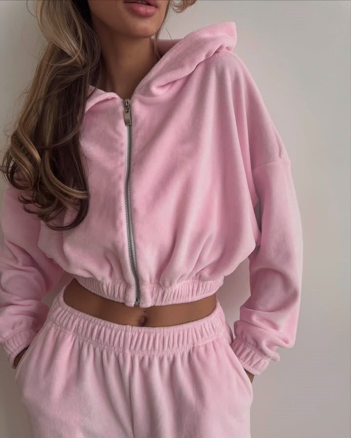 Close-up of the cropped top's front zipper and velvet texture