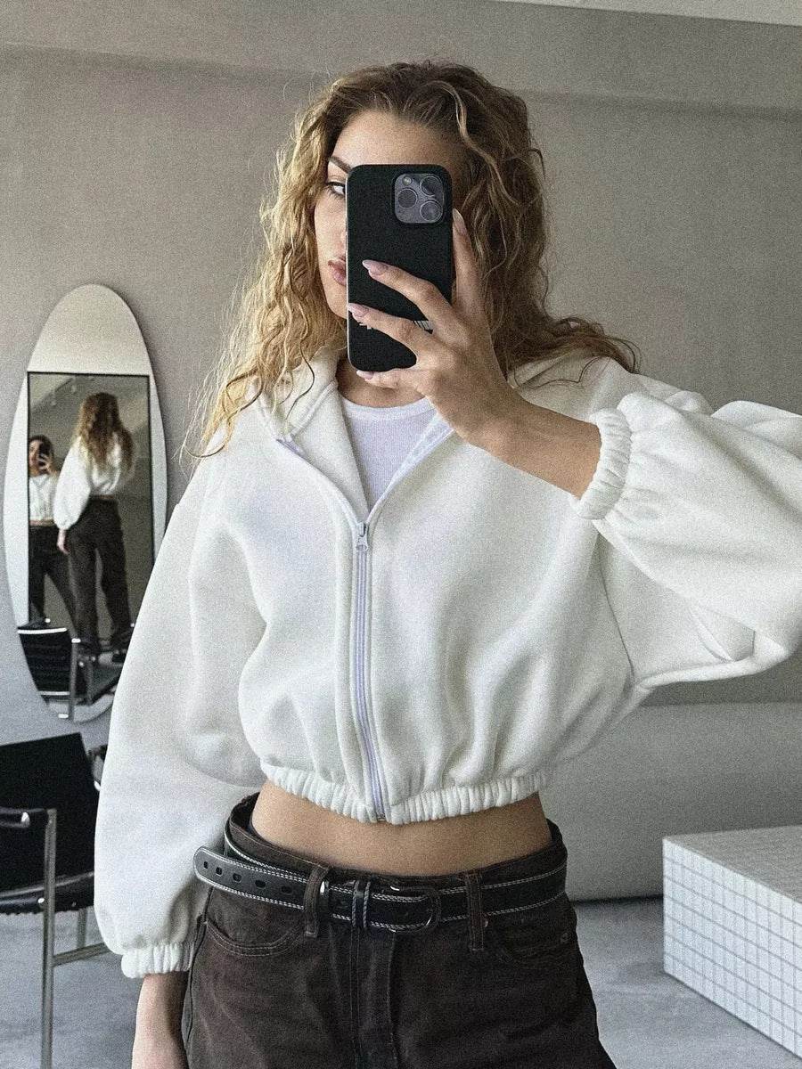 Full product view of a women's oversized cropped hooded jacket