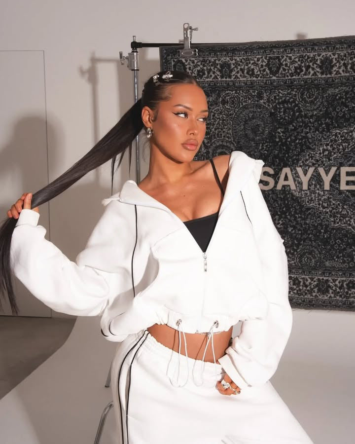 Close-up of the zip-front hooded sweatshirt in the tracksuit set