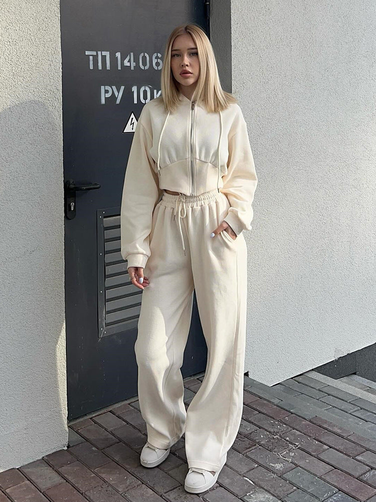 Women's matching hoodie and wide-leg pants styled as a casual outfit
