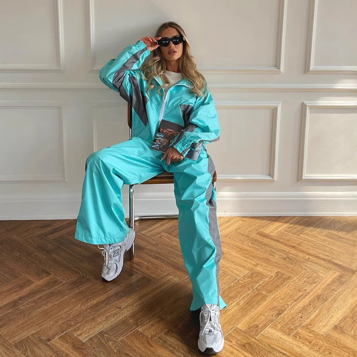 Wide-leg pants paired with a women's windbreaker tracksuit jacket