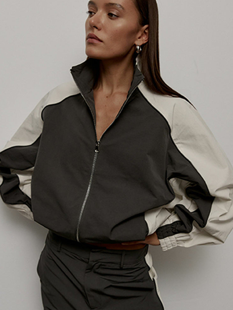 Full product view of the women's oversized track jacket with stand collar