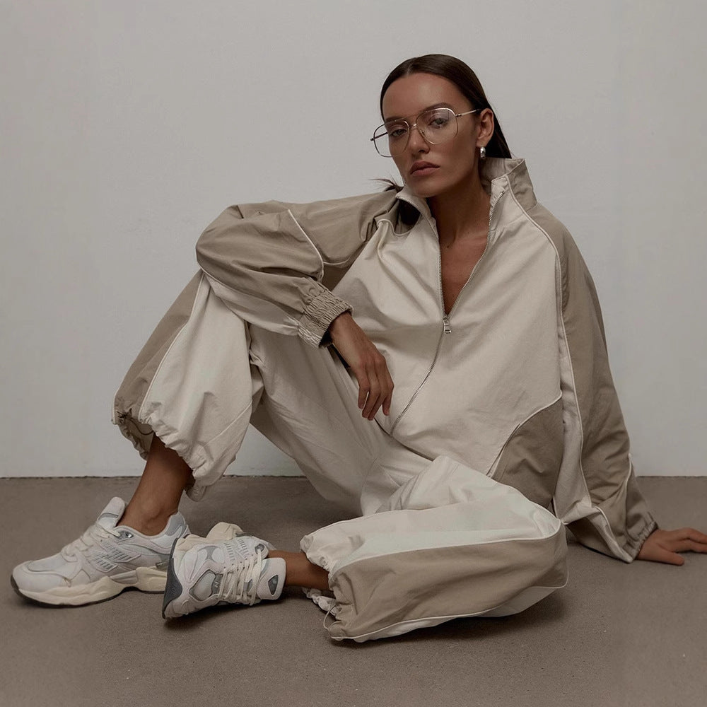 Women's oversized track jacket shown from the front with a stand collar