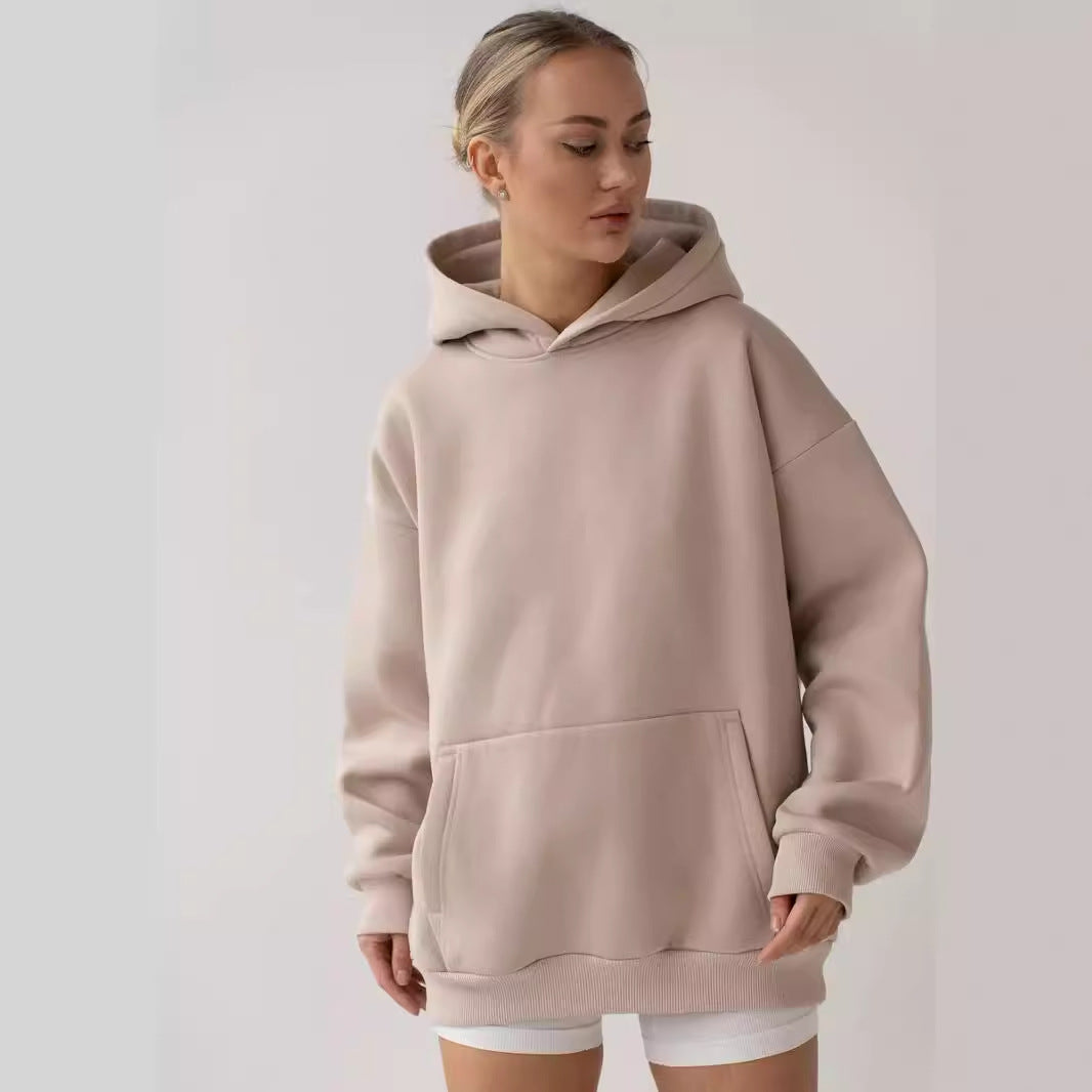 Women's oversized fleece hoodie shown from the front with a roomy hood and kangaroo pocket