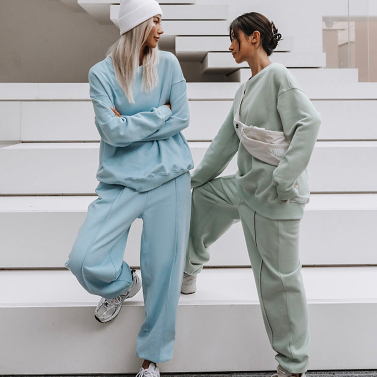 Front view of a women's lounge set with a relaxed sweatshirt and wide-leg pants