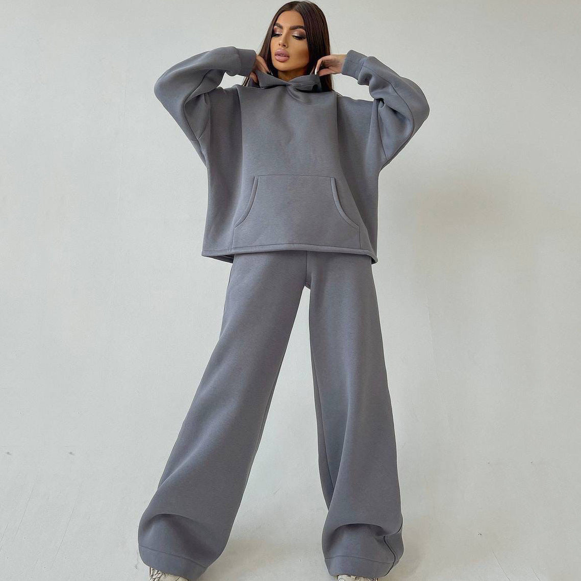 Front view of a women's hoodie and flare pants outfit