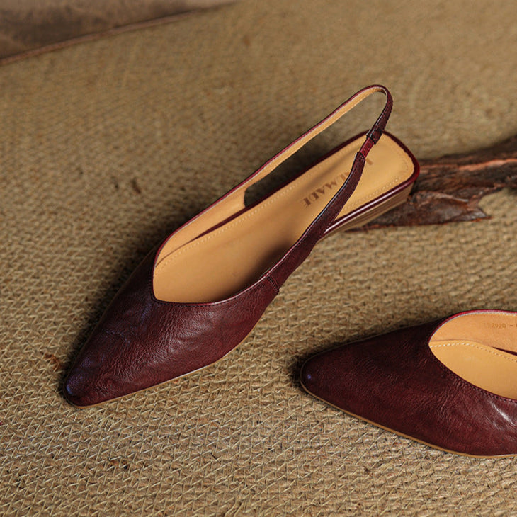 Side profile showing the low heel of leather slingback flats