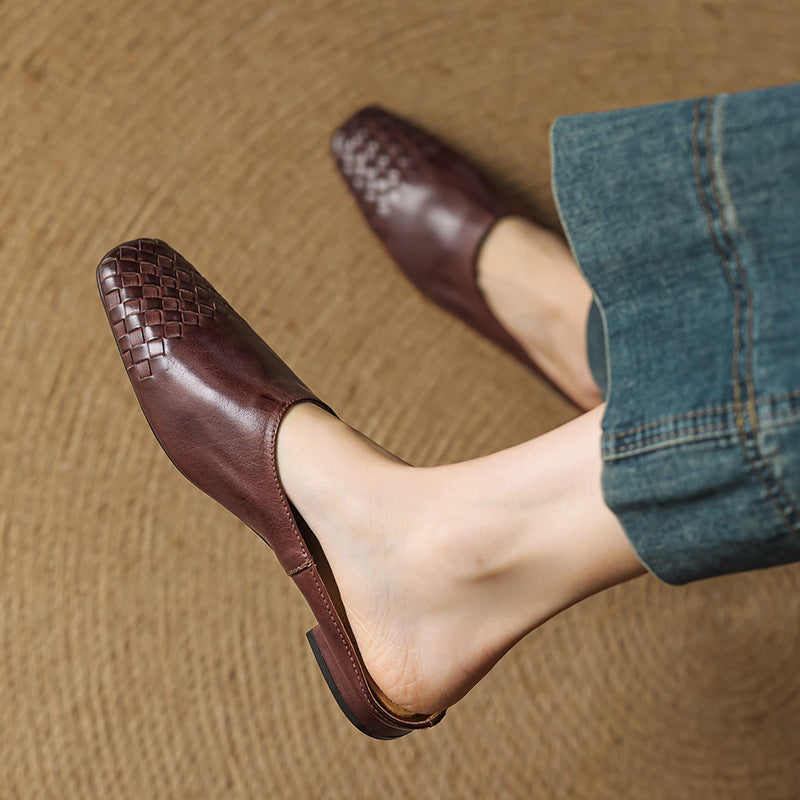 Pair of neutral leather mules with open backs
