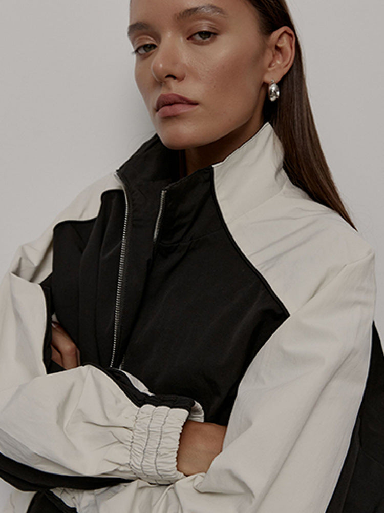 Detail view of the sleeve and raglan seam on the track jacket