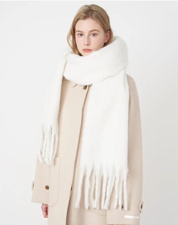 Oversized winter scarf shown as a soft solid-color wrap
