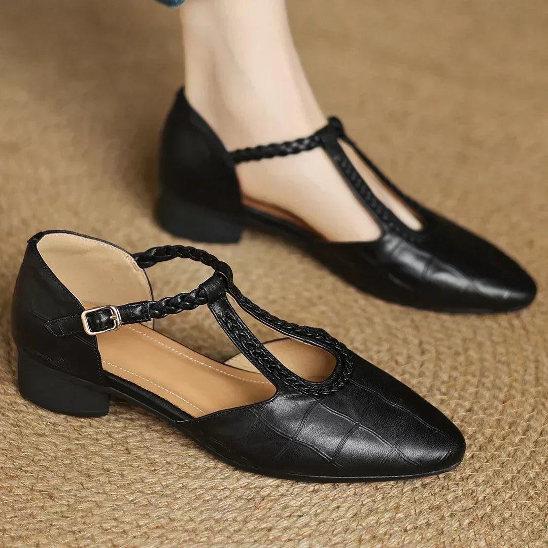Detailed view of the strap and woven accent on women's shoes