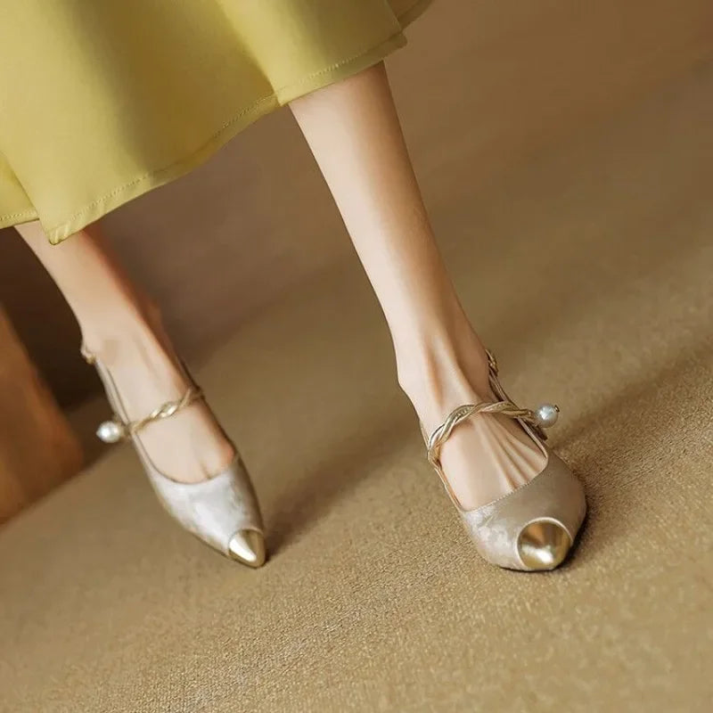 Close-up of women's pumps highlighting the refined heel and silhouette